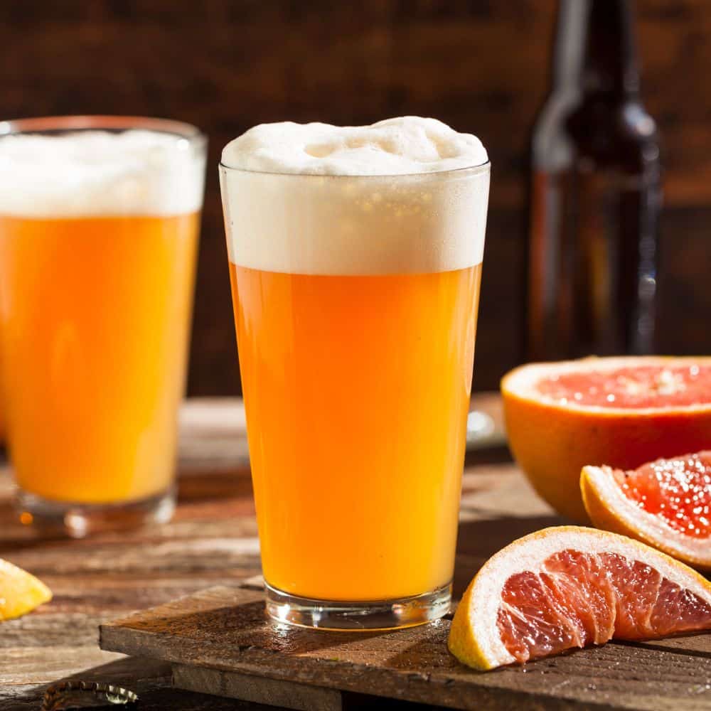 Beer craft beer with grapefruits besides it